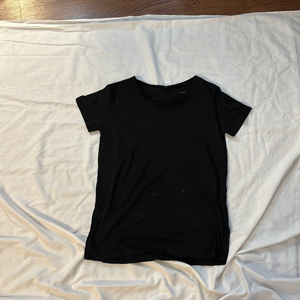 Black plain top with cut out wing design in the back